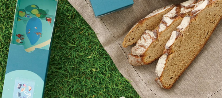 dnata sliced brown bread on rug on grass