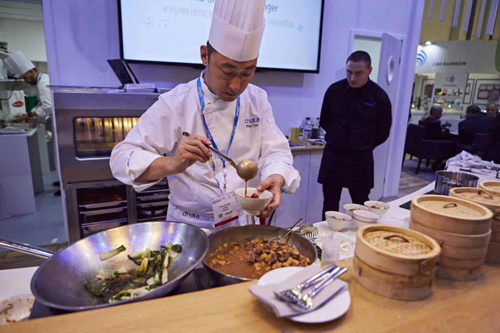 chef at WTCE ladling from a dish