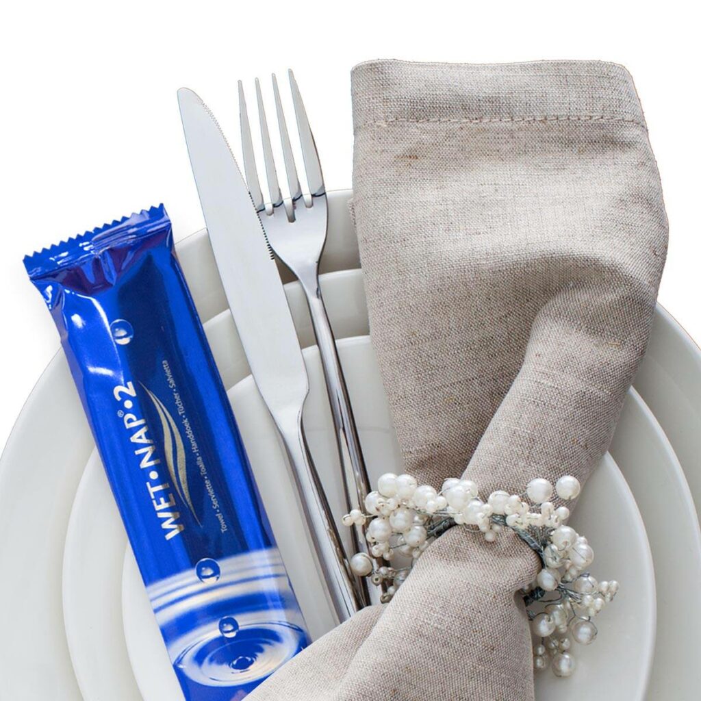 wet nap packet with cutlery on plate