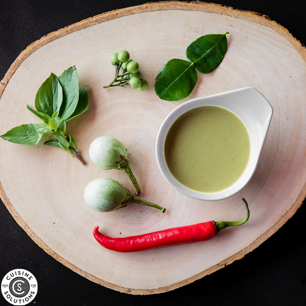 thai green curry sauce on  wooden surface