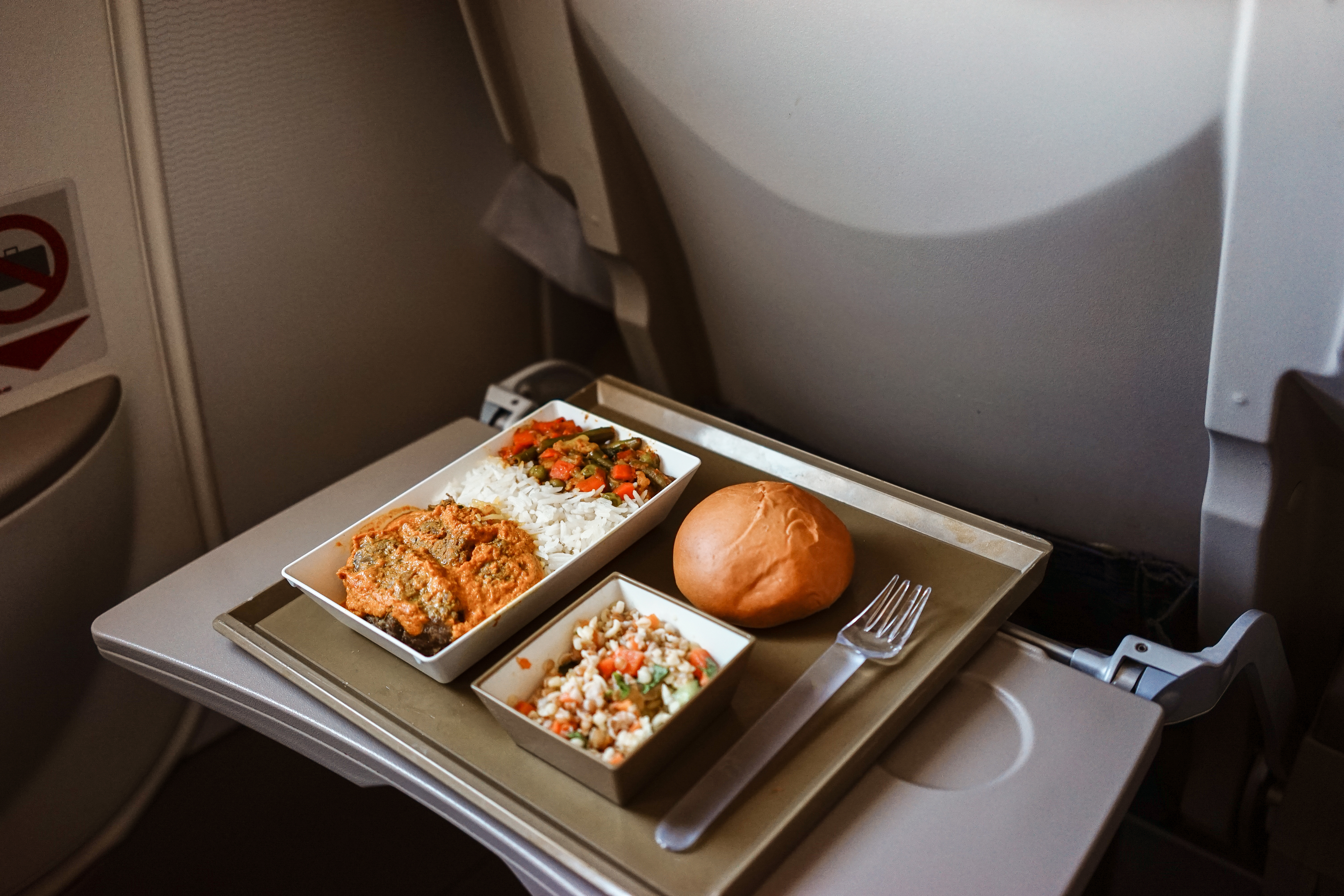 Food on the plane rice and Kari, Asian cuisine.