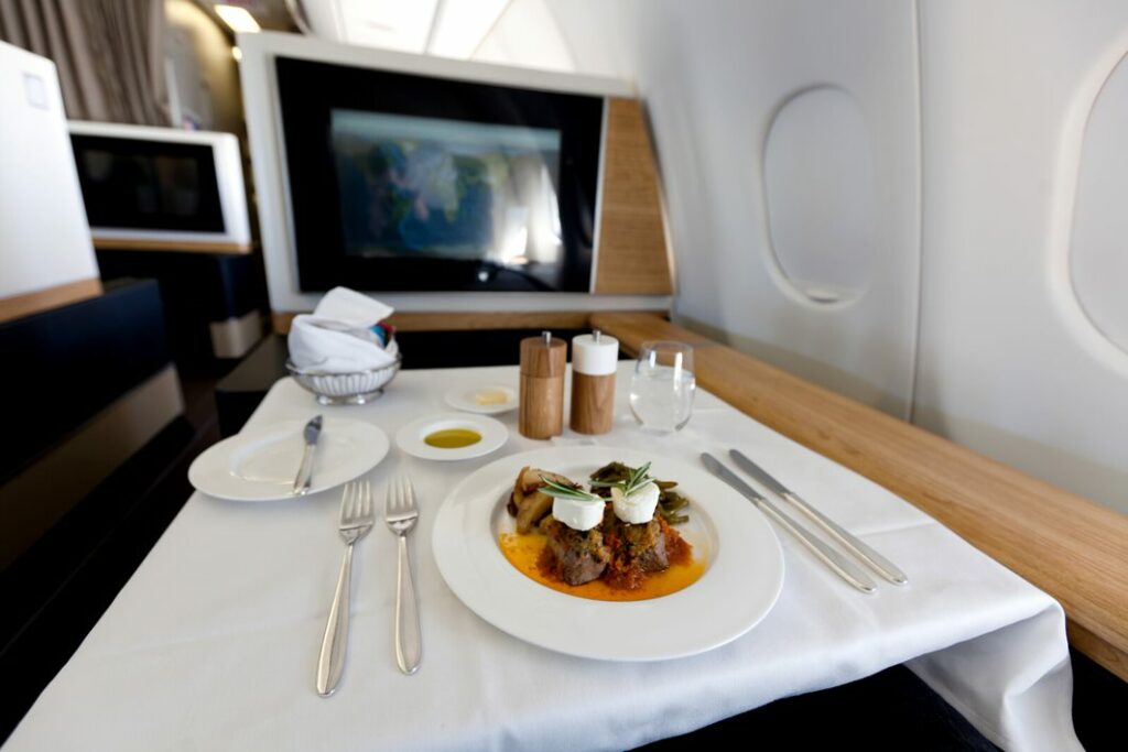 food on a place setting in a first or business class cabin seat