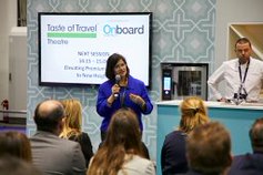 woman speaking in front of screen at taste of travel