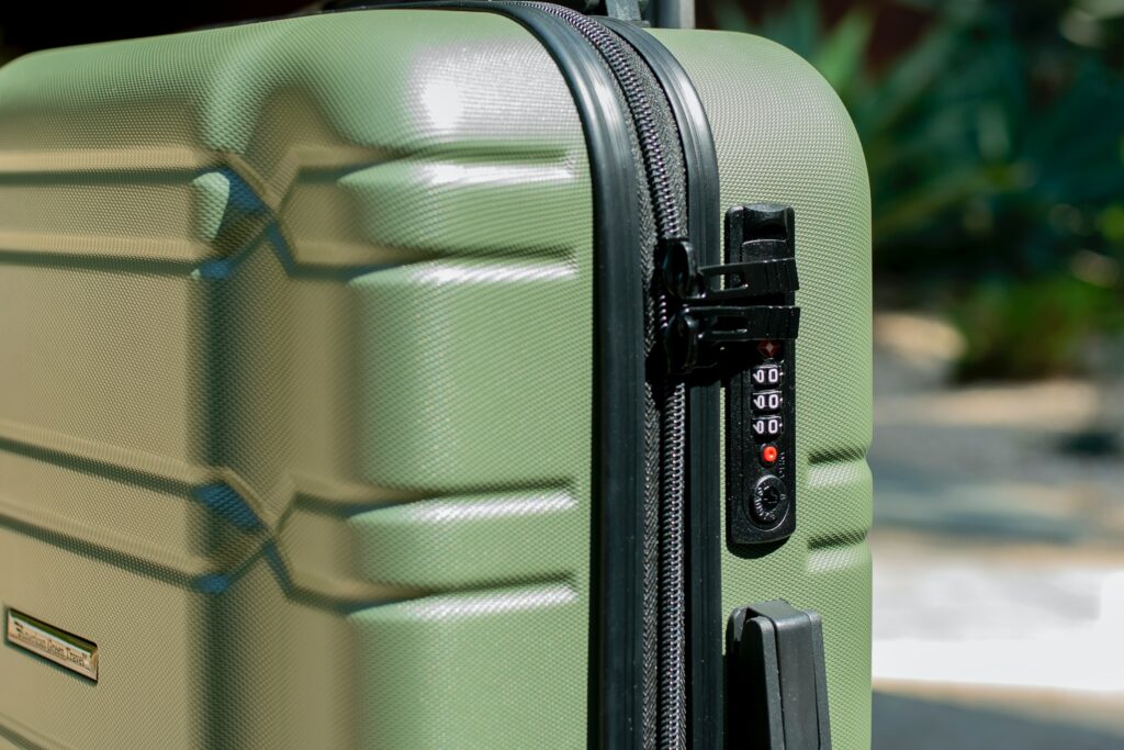 green suitcase with tsa locks