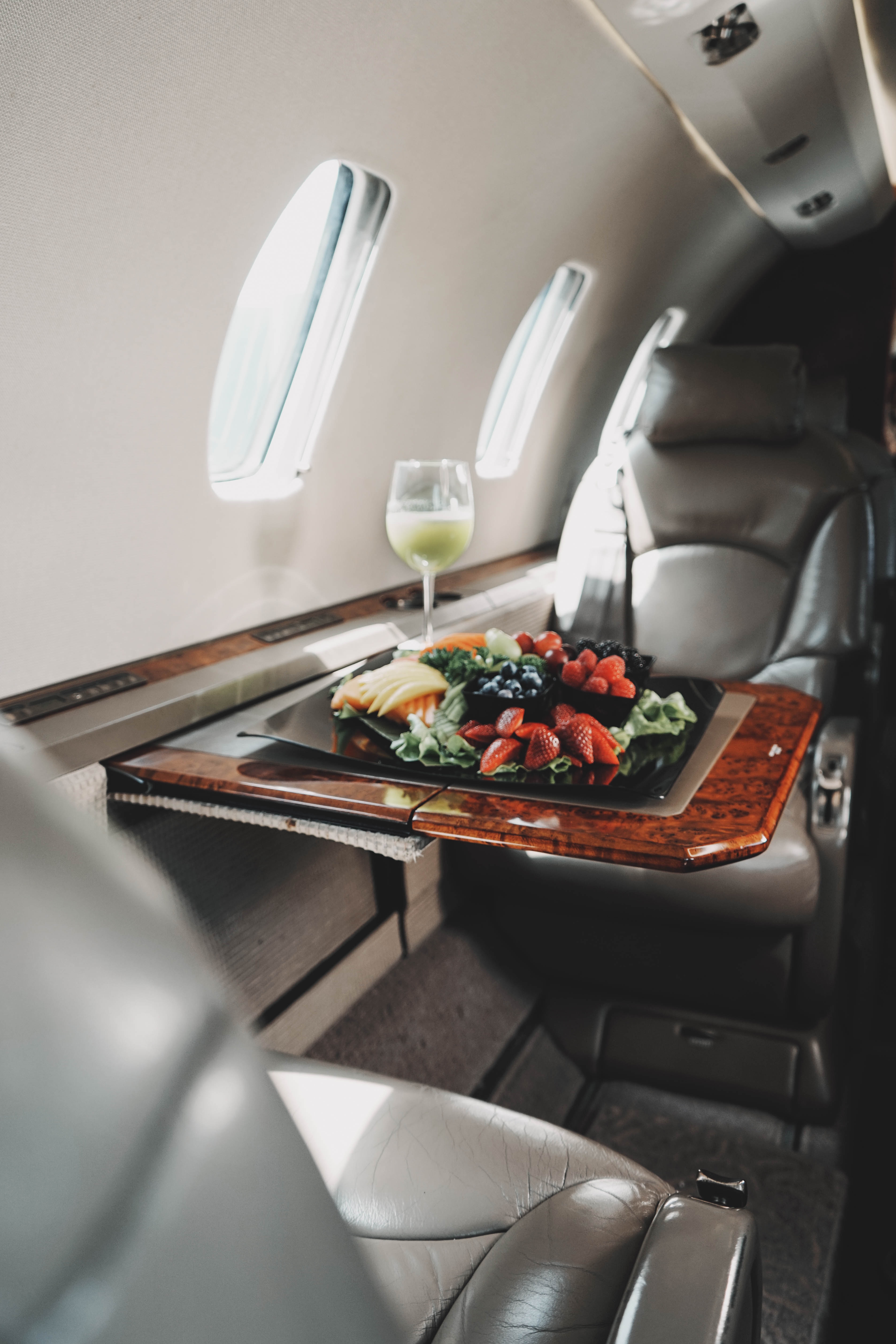 private jet meal with wine glass