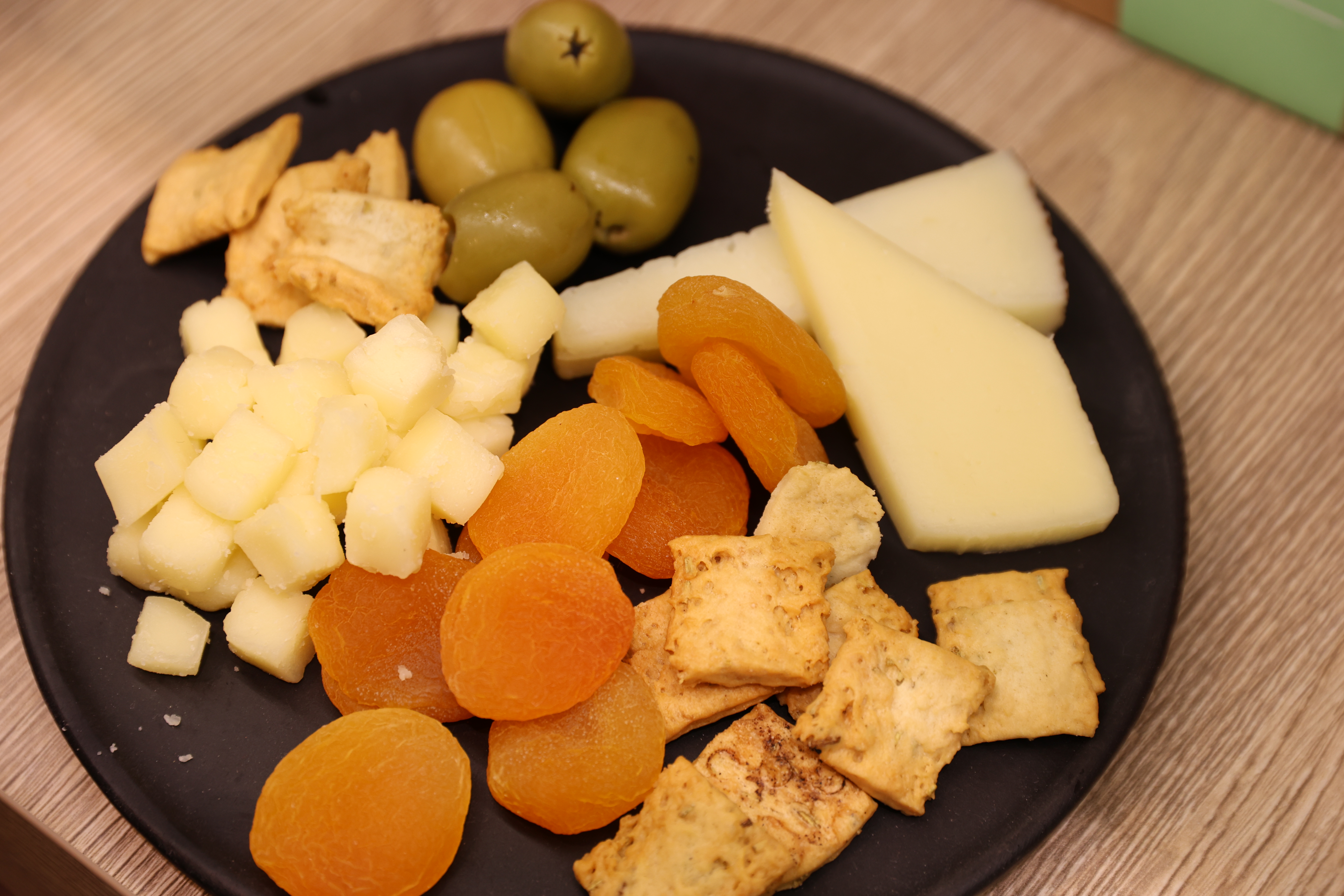 grazing plate of cheese, crackers, apricots