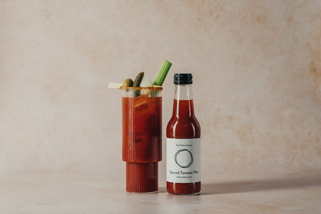 unrooted bloody mary mix bottle and glass